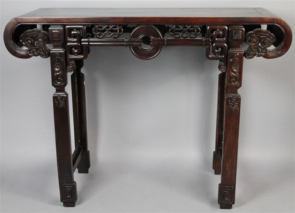 Appraisal: CHINESE CARVED HARDWOOD ALTAR TABLE the scrolling top with carved