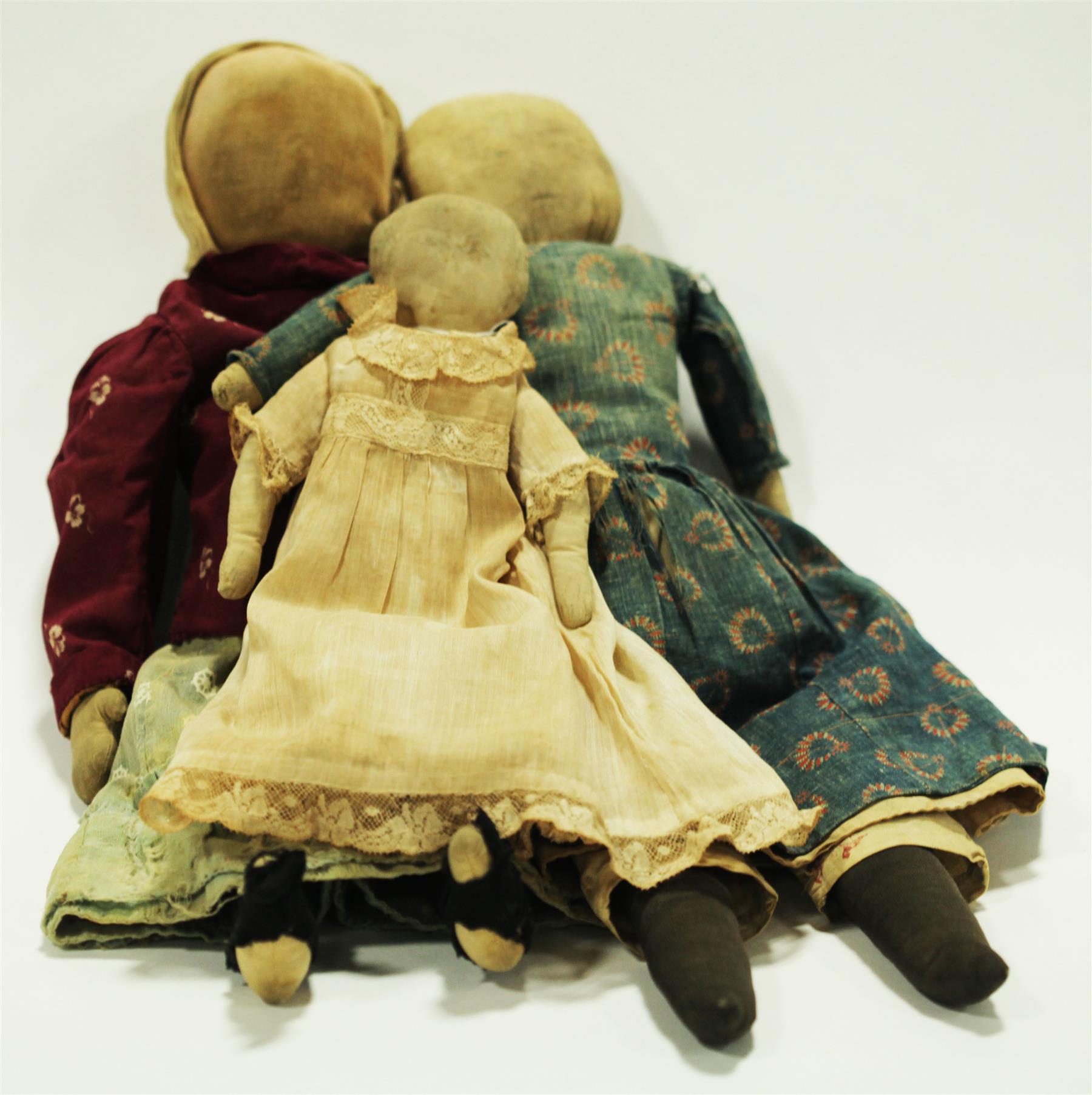 Appraisal: THREE CLOTH DOLLS TWO WITH DRAWN FEATURES American late th