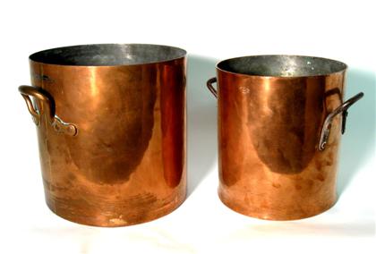 Appraisal: Two large cylindrical copper kettles th th century Straight sides