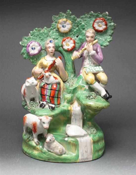 Appraisal: English Staffordshire earthenware figural group of a shepherd shepherdess and