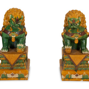 Appraisal: A Large Pair of San ai-Glazed Porcelain Guardian Lions th