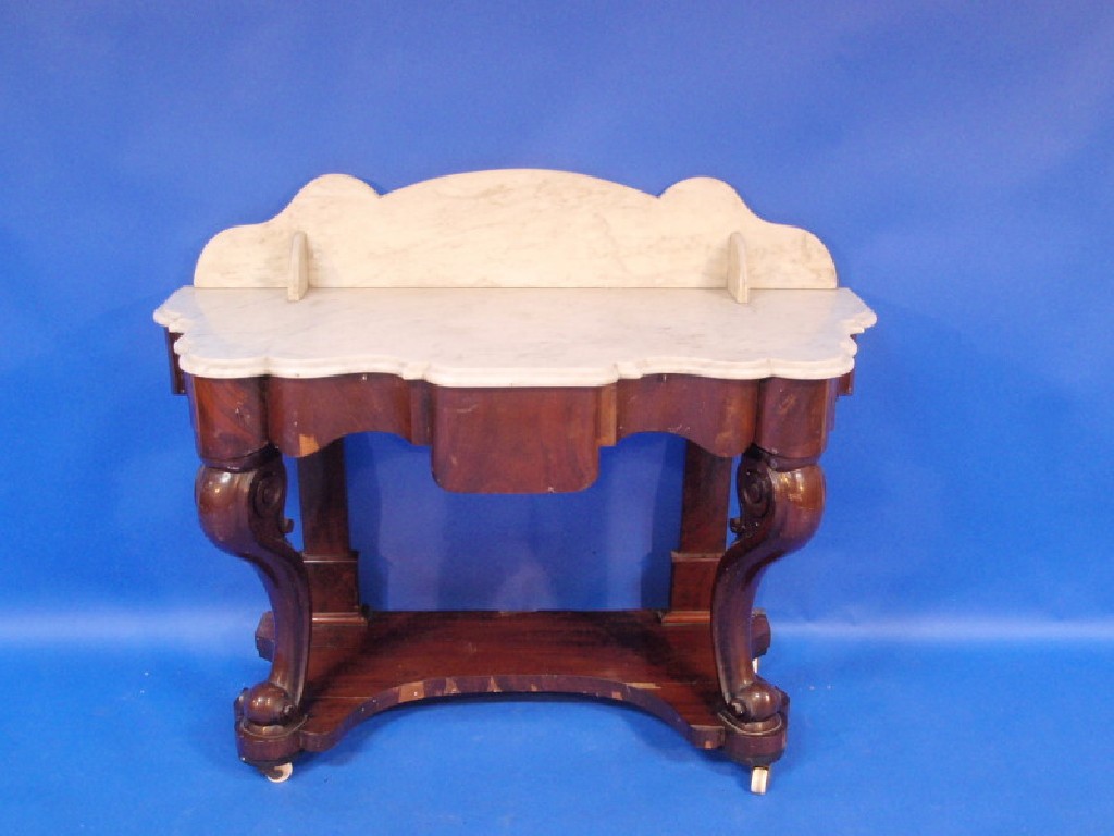 Appraisal: A Victorian flamed mahogany Duchess wash stand with shaped marble