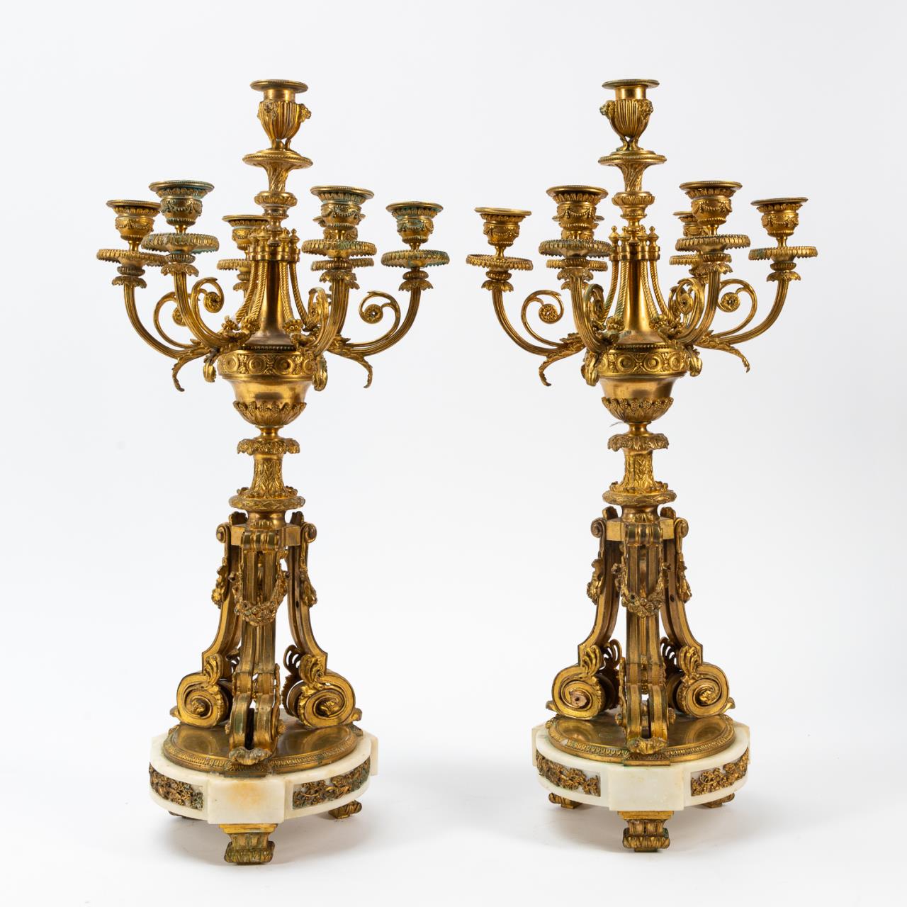 Appraisal: PR LOUIS XIV-STYLE ORMOLU SEVEN-LIGHT CANDELABRA French th century pair