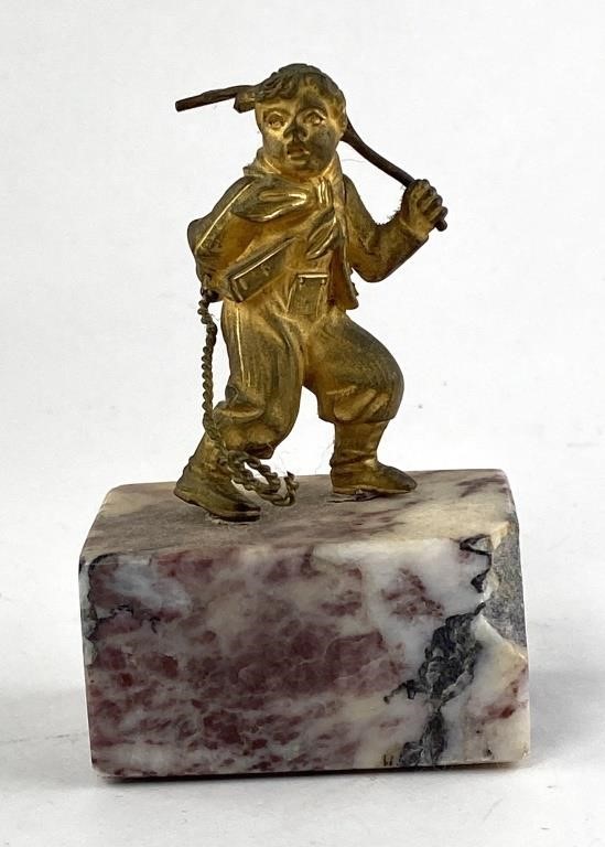 Appraisal: Tiny gold gilt bronze miniature hunter boy on a small