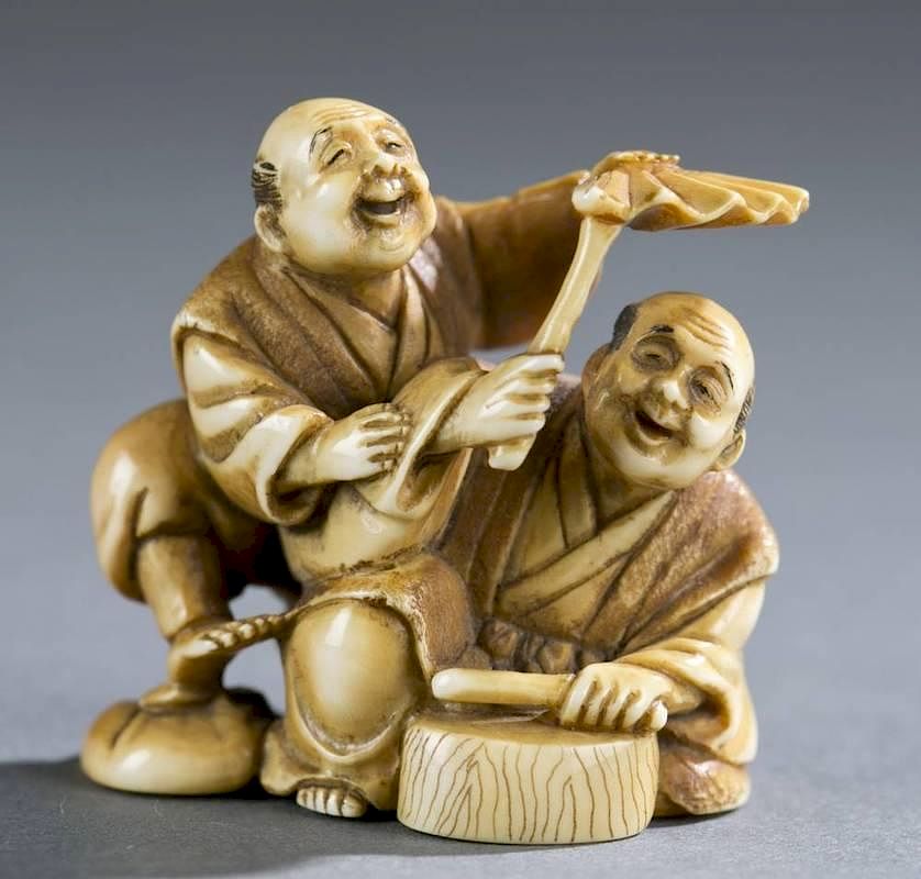 Appraisal: Japanese ivory netsuke of drummer A Japanese ivory netsuke of