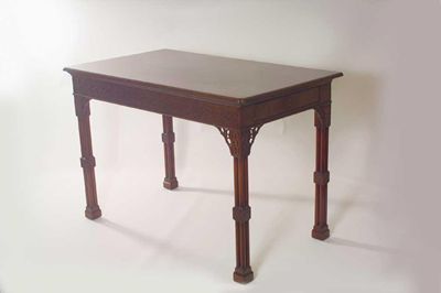 Appraisal: A mahogany serving table the moulded edge top with cusp