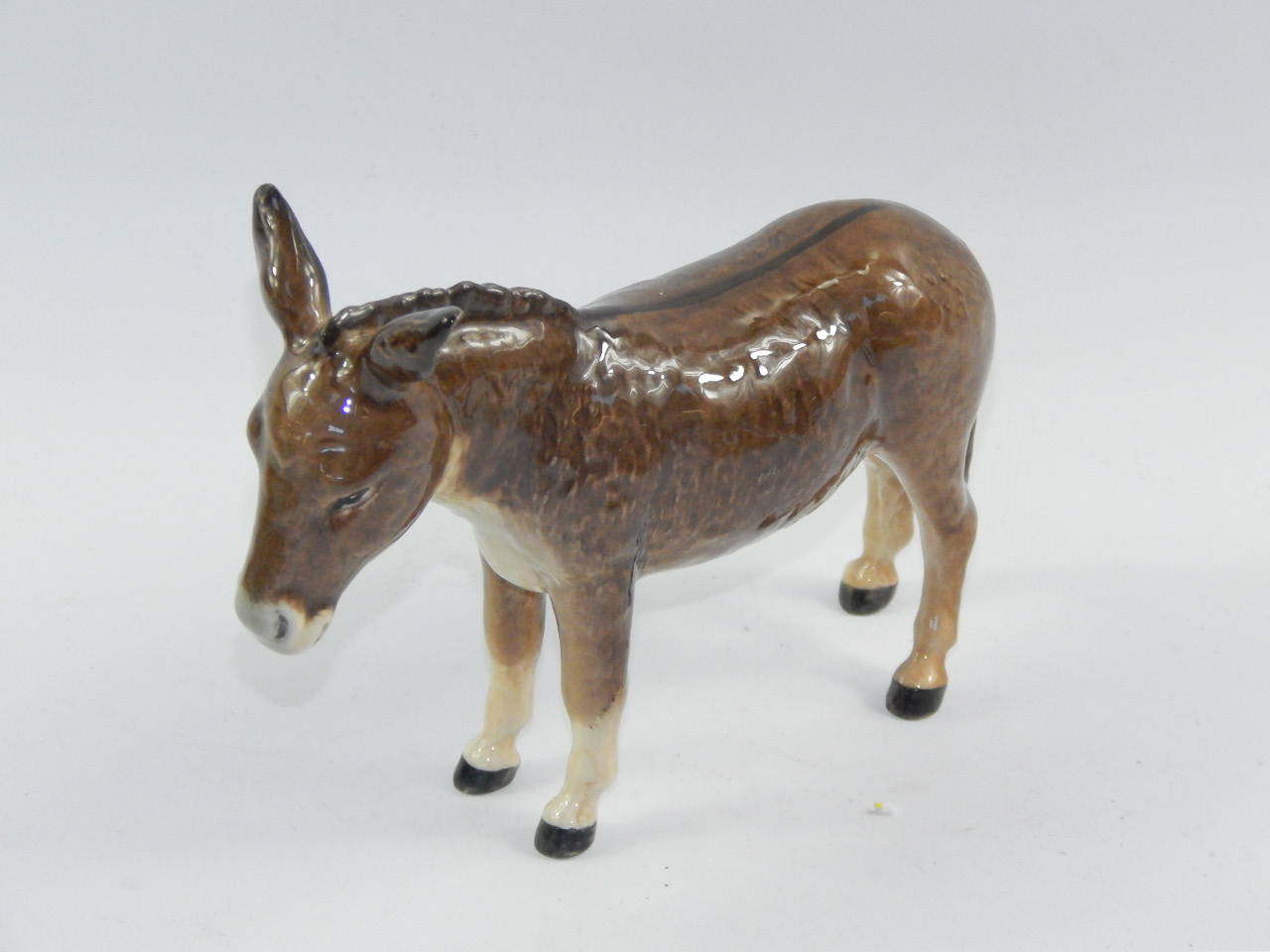 Appraisal: A Beswick figure of a donkey