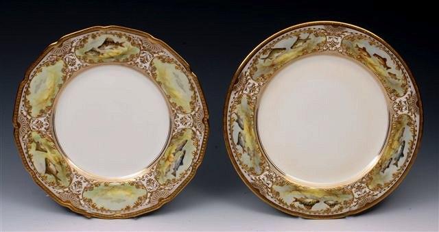 Appraisal: A PAIR OF ROYAL DOULTON CABINET PLATES each with painted