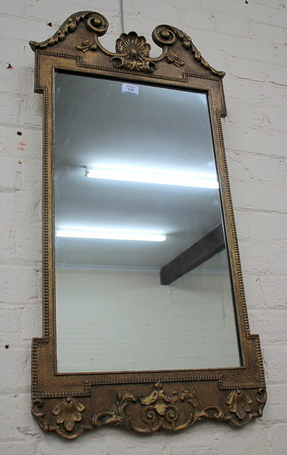 Appraisal: A GEORGIAN STYLE GILT FRAMED PIER GLASS with scrolling break