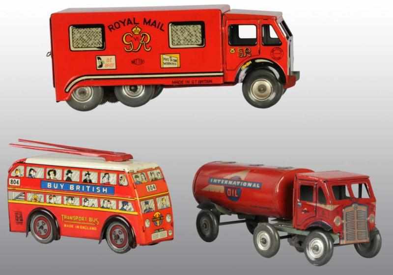 Appraisal: Lot of Tin Vehicle Wind-Up Toys Description English Working Includes