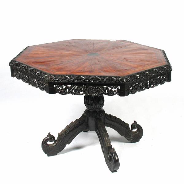 Appraisal: An Anglo Indian ebonized radial veneered center table height in