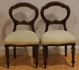 Appraisal: A set of six Victorian mahogany baloon-back dining chairs one