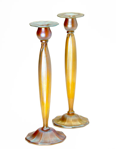 Appraisal: TIFFANY STUDIOS Gold Favrile glass table candlesticks with ribbed baluster