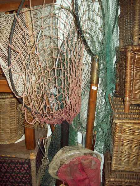 Appraisal: A LARGE COLLECTION OF FISHING NETS IN AN UMBRELLA STAND