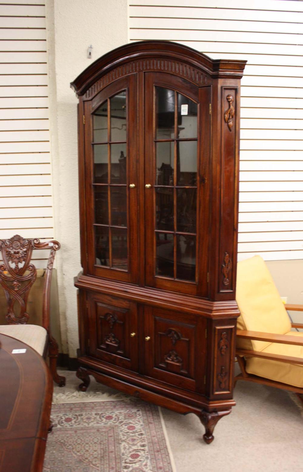 Appraisal: CARVED MAHOGANY CORNER CUPBOARD Queen Anne style antique reproduction late