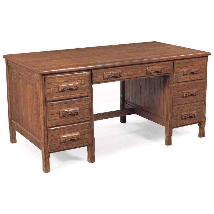 Appraisal: Ranch style desk in distressed oak central drawer flanked by