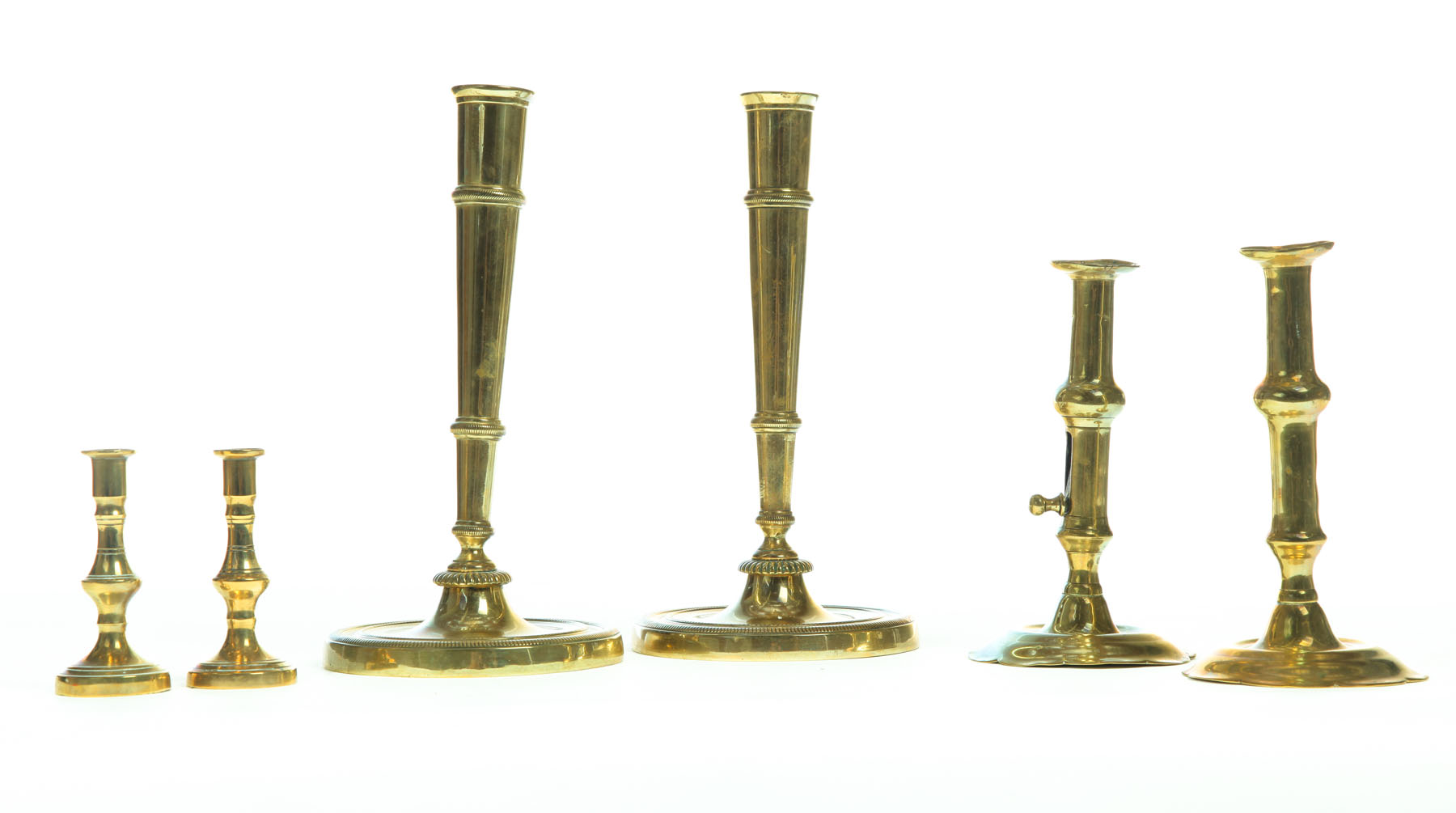 Appraisal: THREE PAIR OF BRASS CANDLESTICKS European th- th century Taper