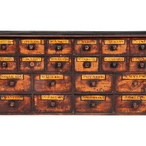 Appraisal: An English Pine Apothecary Chest th Century with labeled compartments