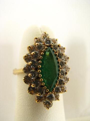 Appraisal: K yellow gold ring with marquis cut emerald center stone