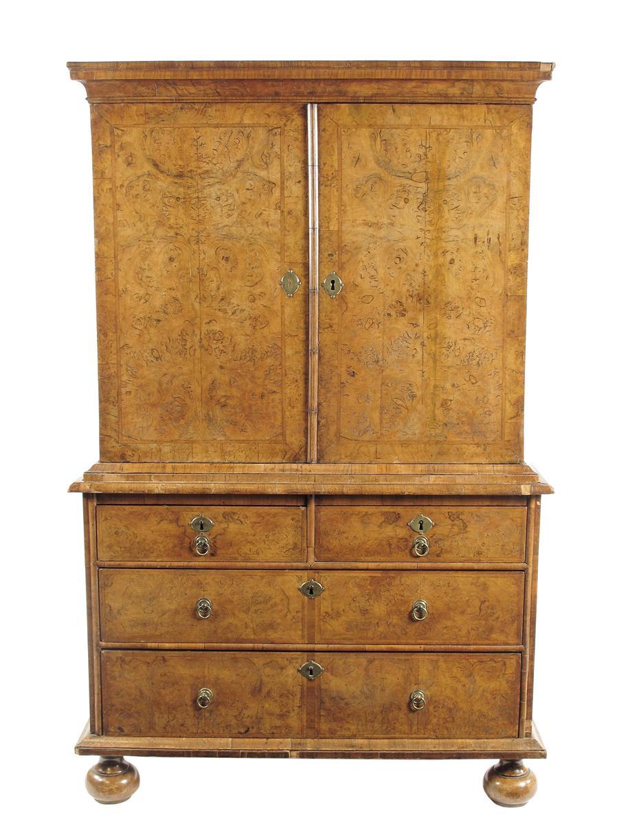 Appraisal: A Queen Anne walnut cabinet on chest