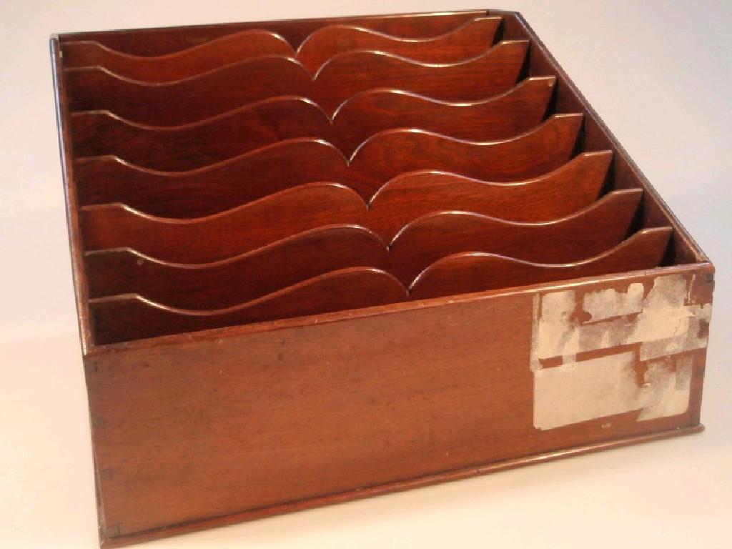 Appraisal: A mahogany stationary rack with shaped and graduated divisions cm