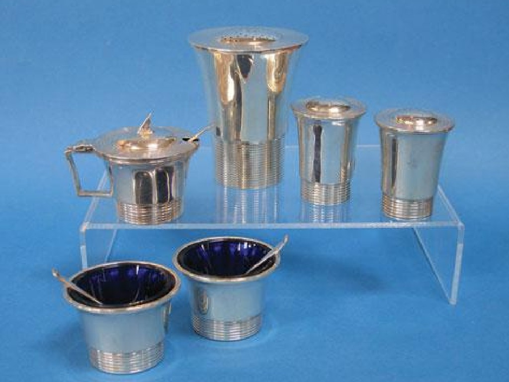 Appraisal: AN ART DECO CONDIMENT SET comprising sugar castor a pair