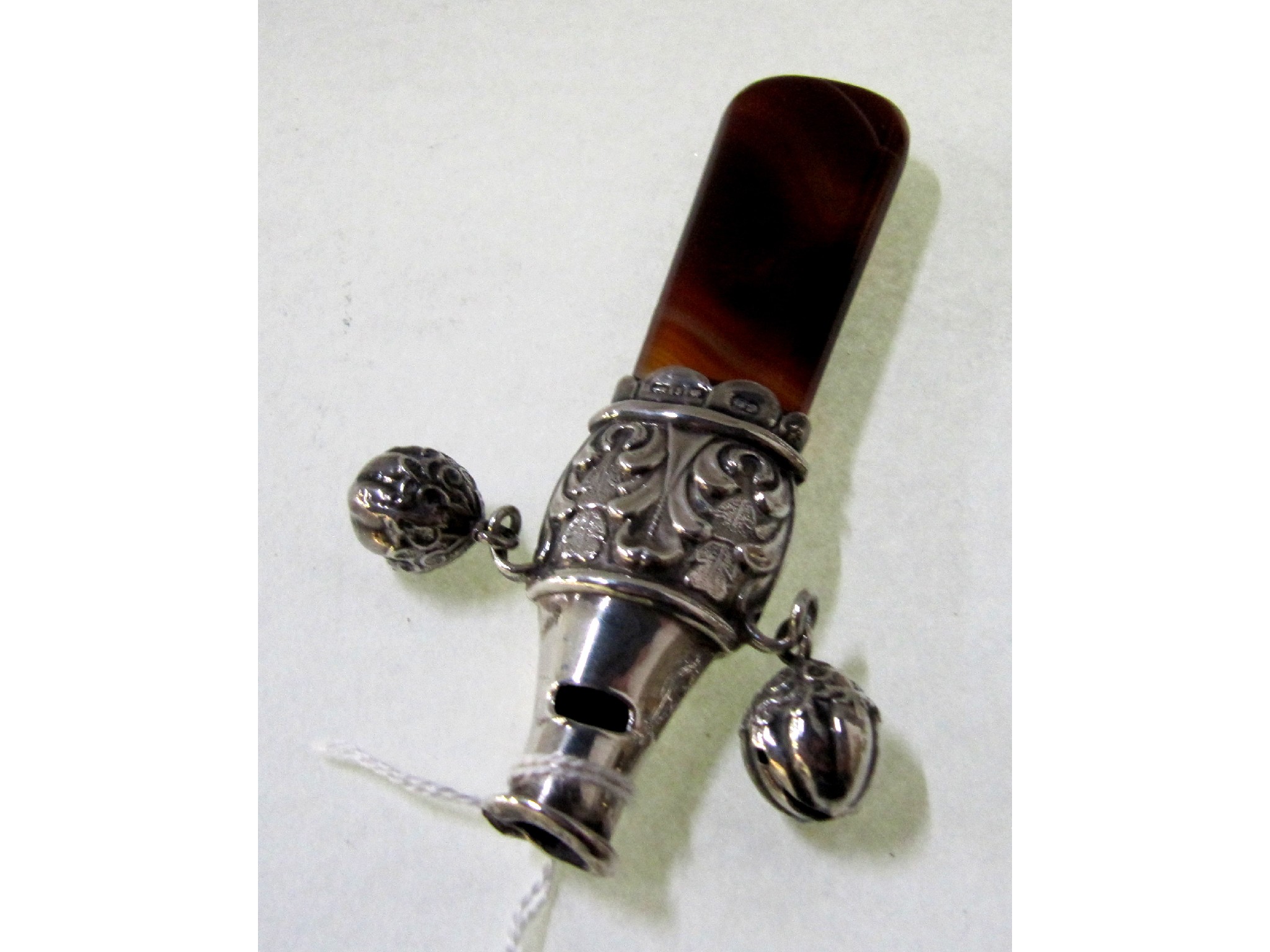 Appraisal: A silver and agate baby rattle Birmingham