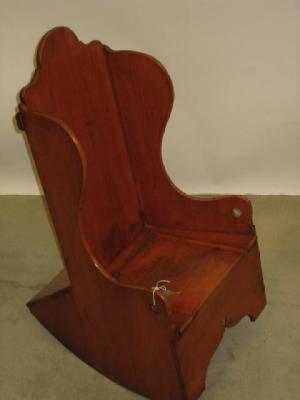 Appraisal: A CHILD'S VICTORIAN SATIN WALNUT ROCKING CHAIR of wing back