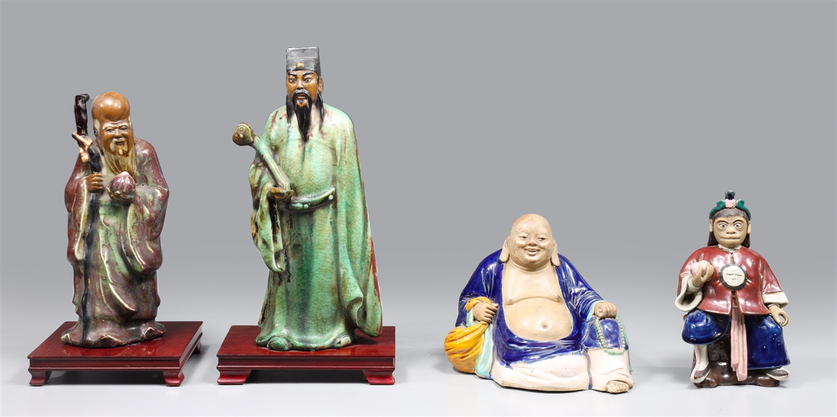 Appraisal: Group of four Chinese ceramic figures including immortal with base