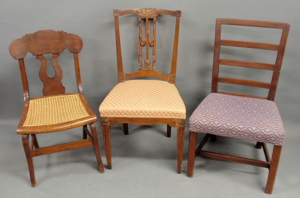 Appraisal: Three chairs- saber leg w cane seat ladder-back and a