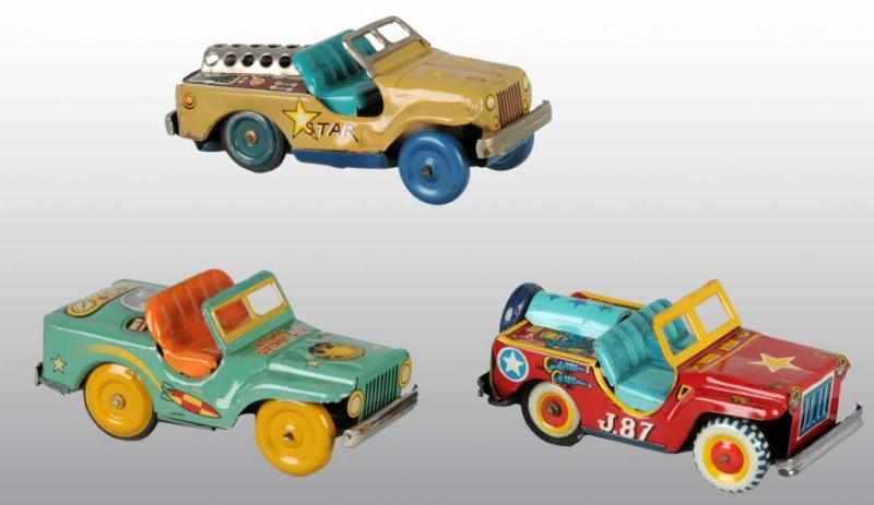 Appraisal: Lot of Tin Space Jeep Friction Toys Description Japanese Circa