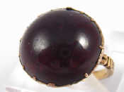 Appraisal: A yellow metal tests gold cabochon garnet ring garnet approx