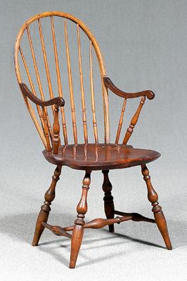 Appraisal: Pennsylvania Windsor armchair spindle back mahogany arms pine shaped plank