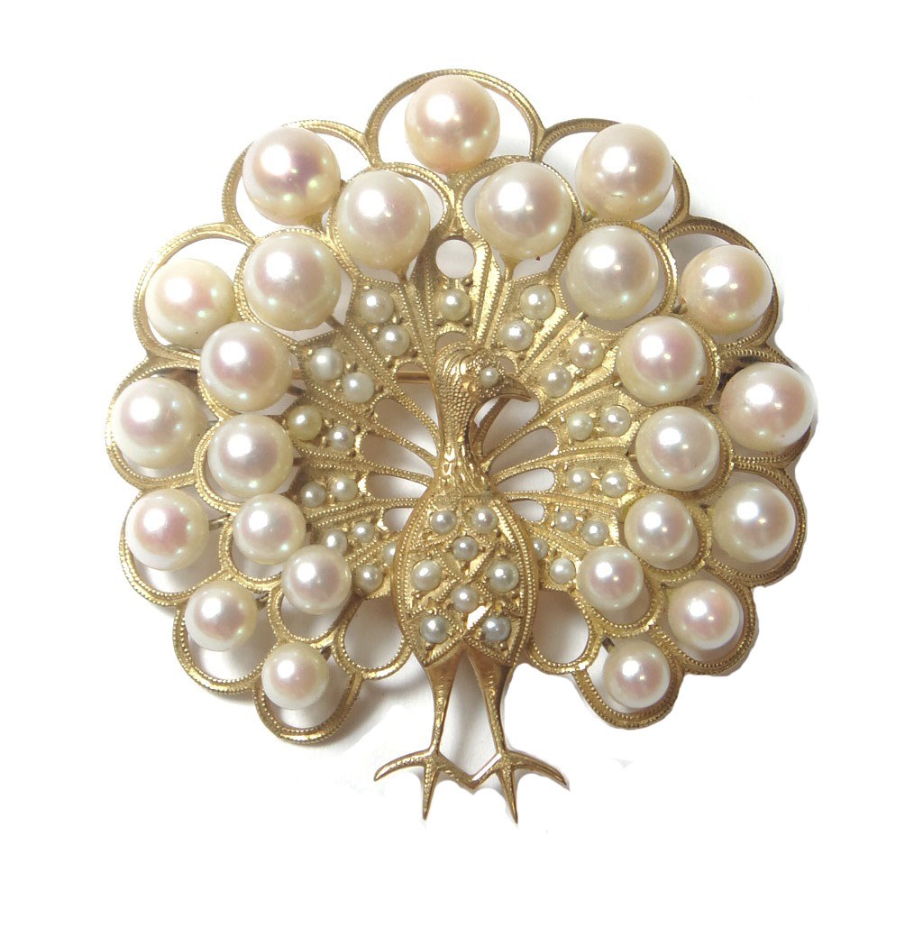 Appraisal: A gold and cultured pearl set brooch designed as a