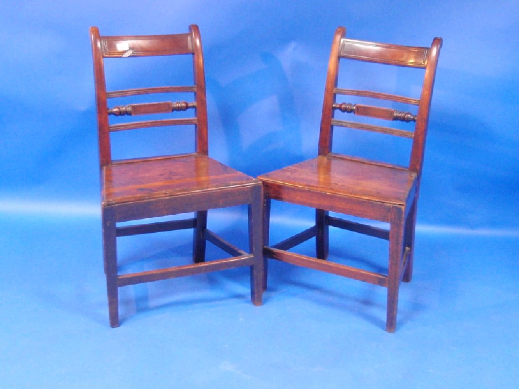 Appraisal: A pair of thC mahogany dining chairs turned horizontal rails