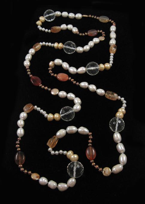 Appraisal: BEADED NECKLACE strung with white yellow and bronze pearls oval