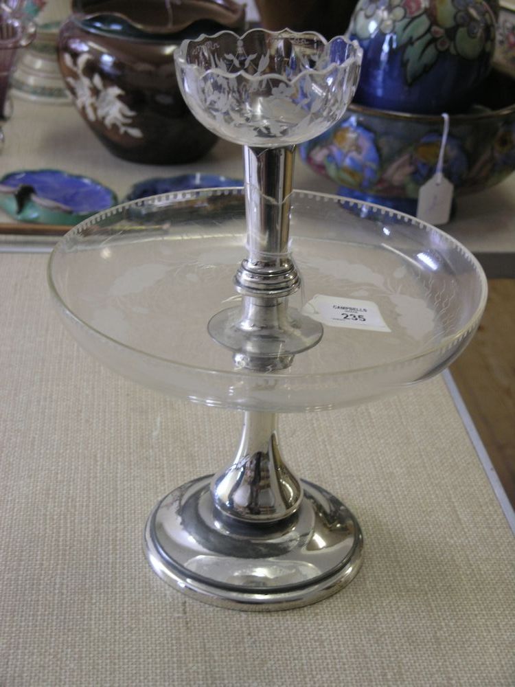 Appraisal: An engraved glass comport two-tiered on Walker Hall plated stand