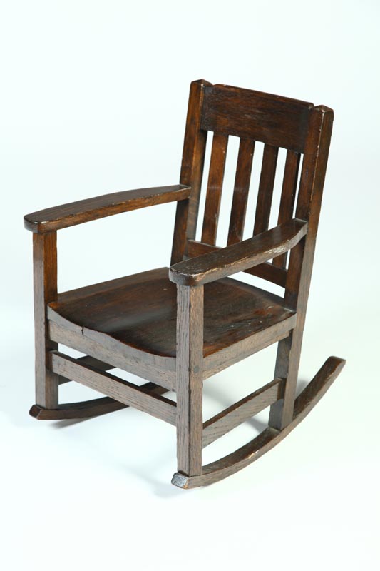 Appraisal: ARTS CRAFTS CHILD'S ARMCHAIR ROCKER American early th century oak