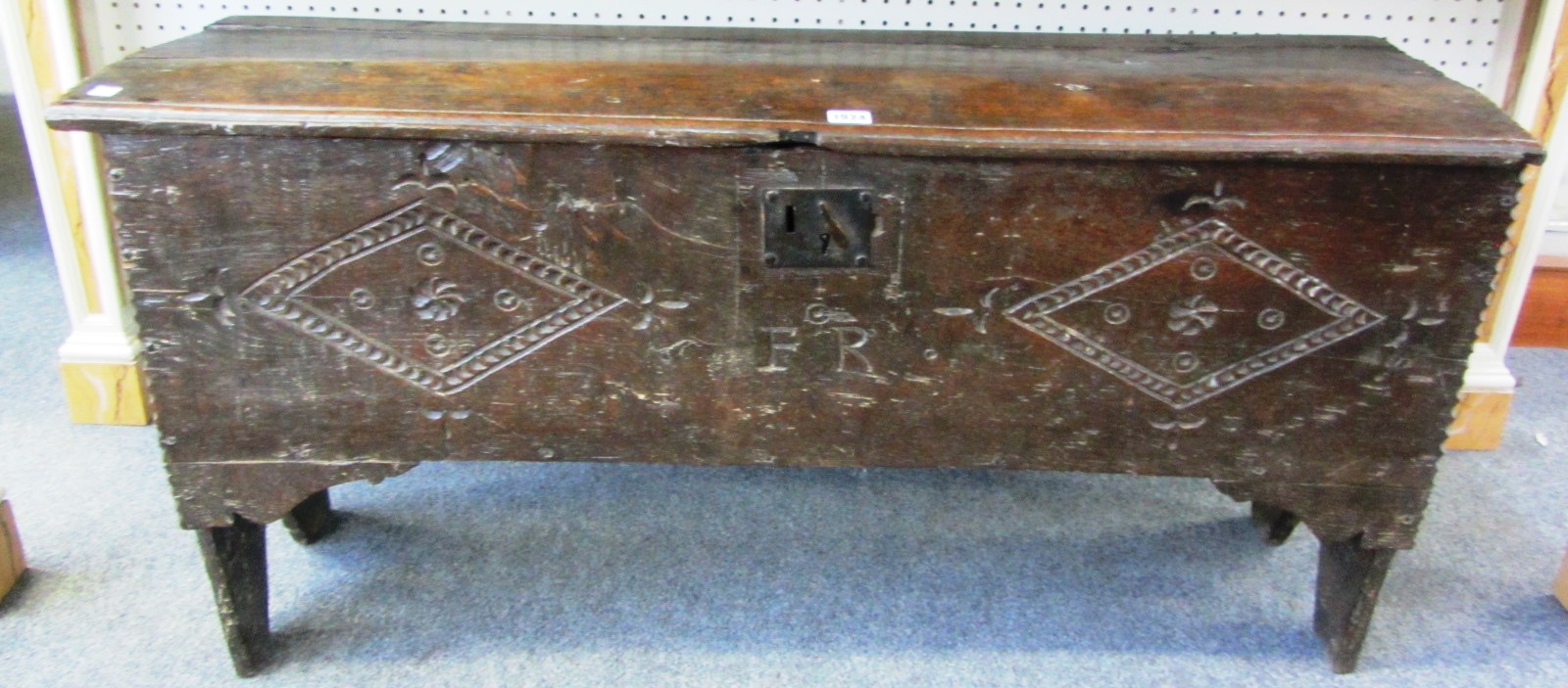 Appraisal: A th century oak plank coffer the carved front panel