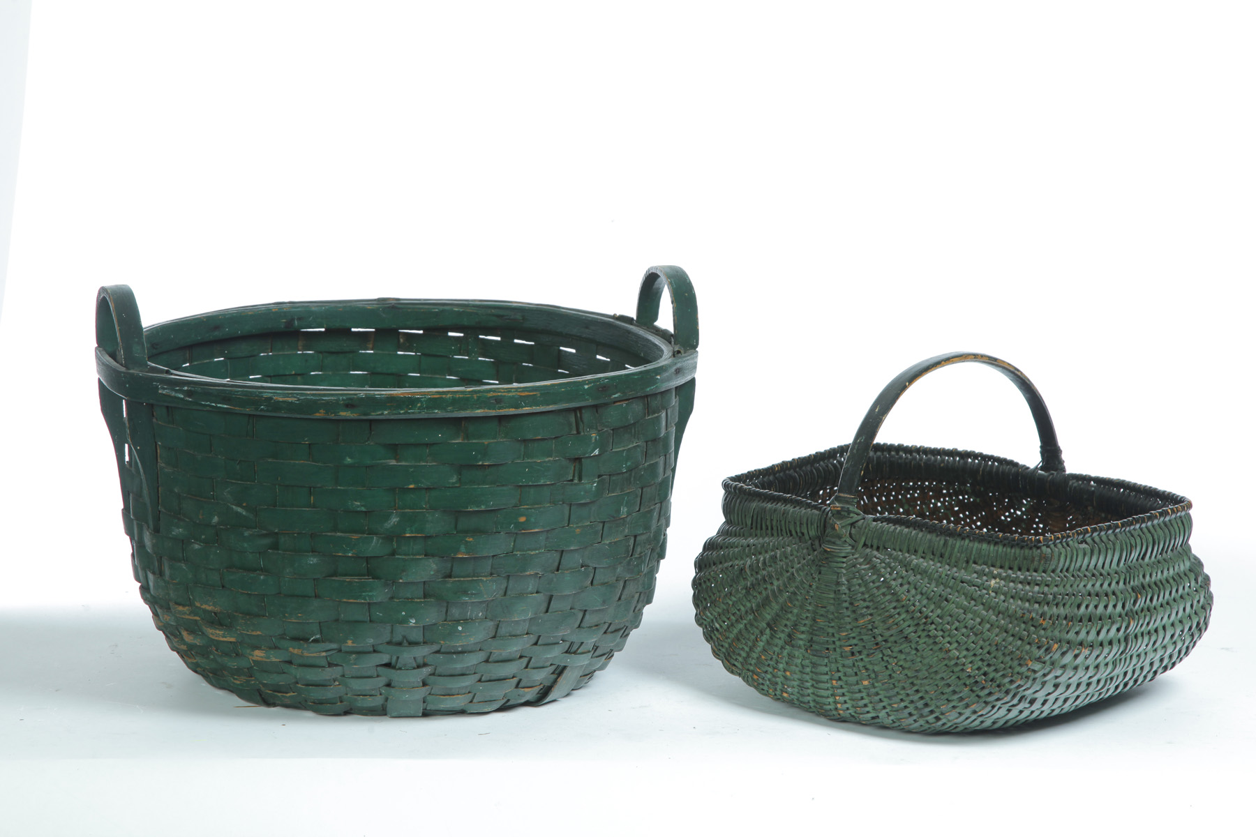 Appraisal: TWO AMERICAN PAINTED BASKETS Late th-early th century woven splint