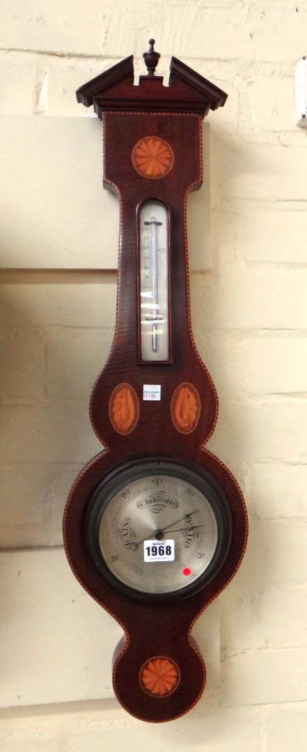 Appraisal: An Edwardian wheel barometer by Ross London the broken arch