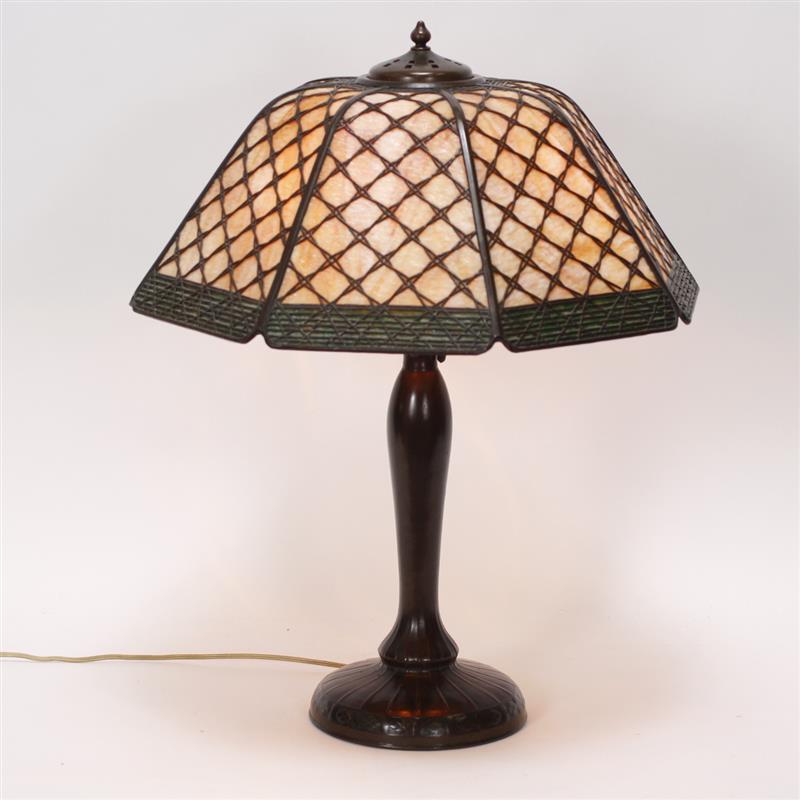 Appraisal: The Handel Lamp Company bronze basketweave overlay slag glass lamp