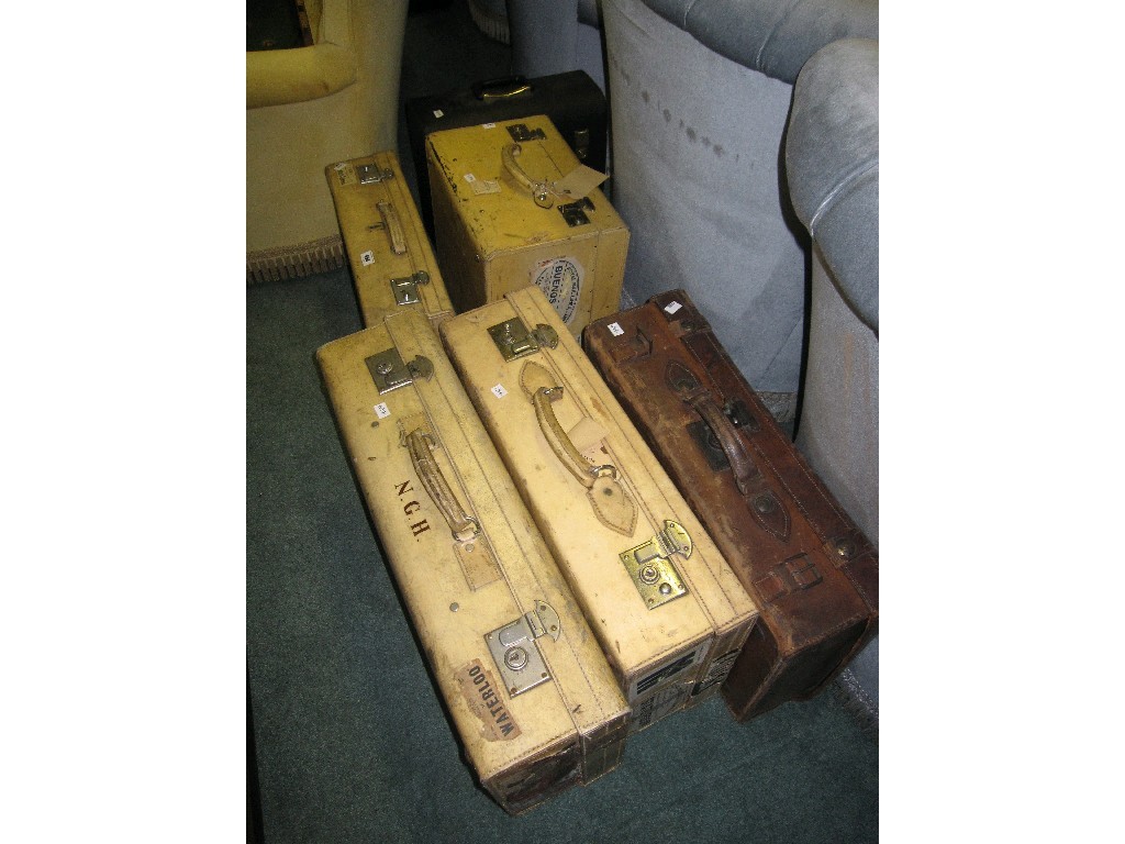 Appraisal: Lot comprising three white leather suitcases a travel trunk picnic