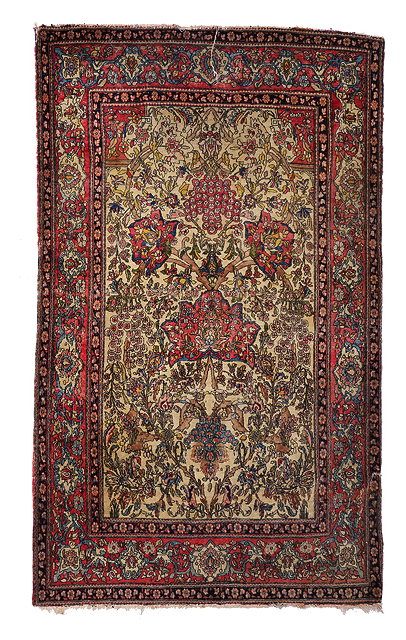 Appraisal: AN OLD PERSIAN WHITE GROUND RUG with an intricate design