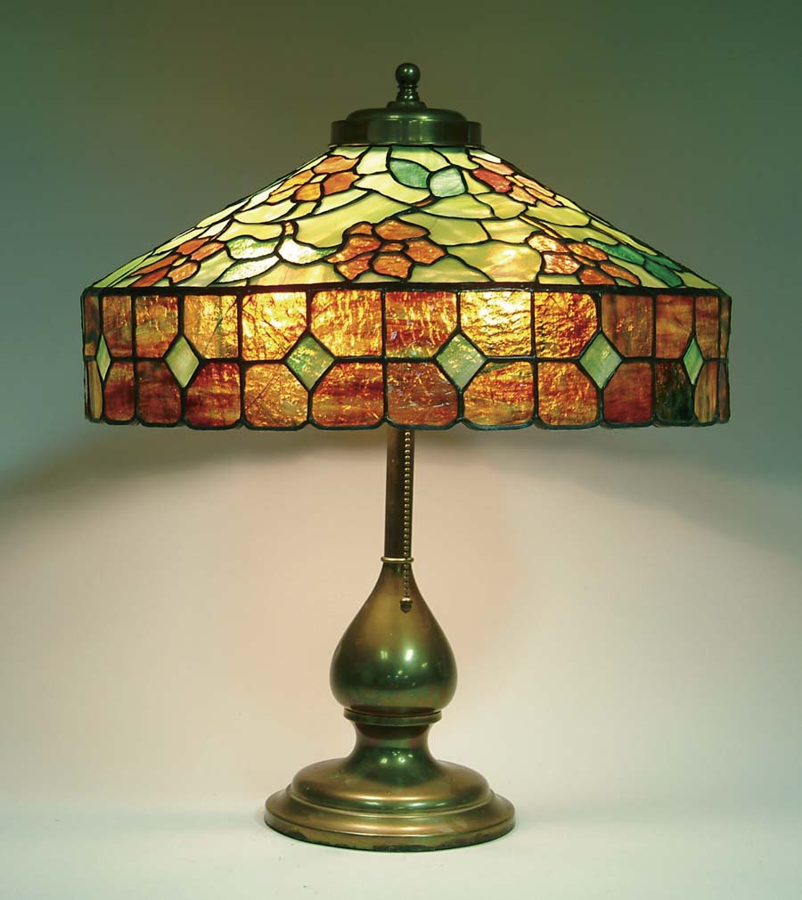 Appraisal: FLORAL LEADED GLASS TABLE LAMP Unsigned shade has reddish five