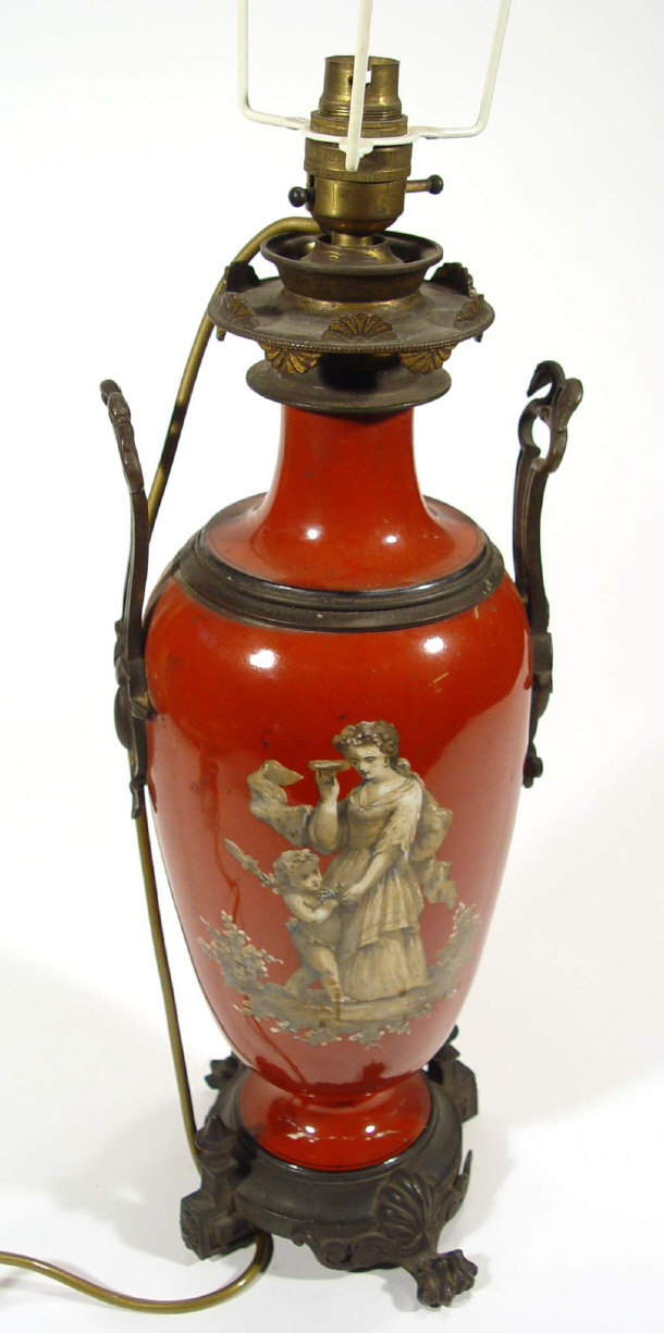 Appraisal: Victorian red ground lamp base decorated with mother and child