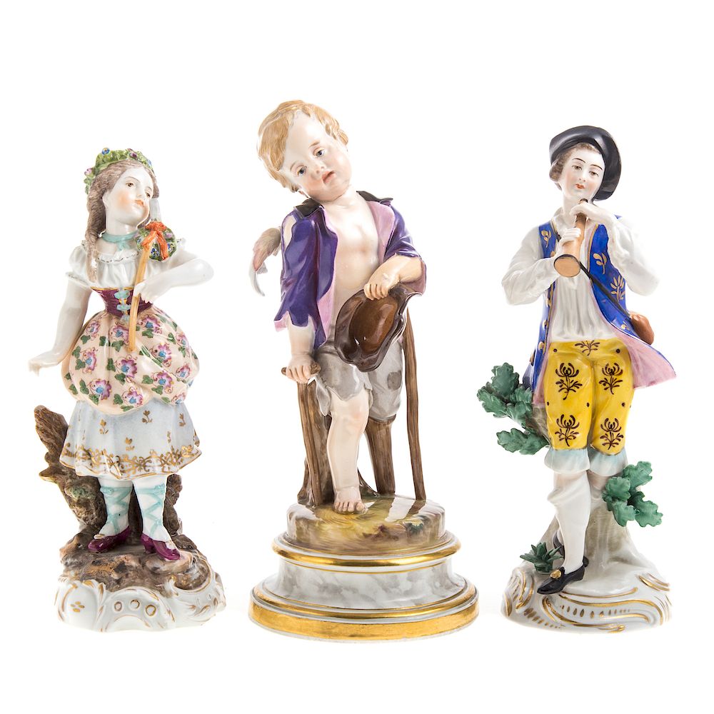 Appraisal: Meissen porcelain putto two German figures Meissen porcelain destitute putto