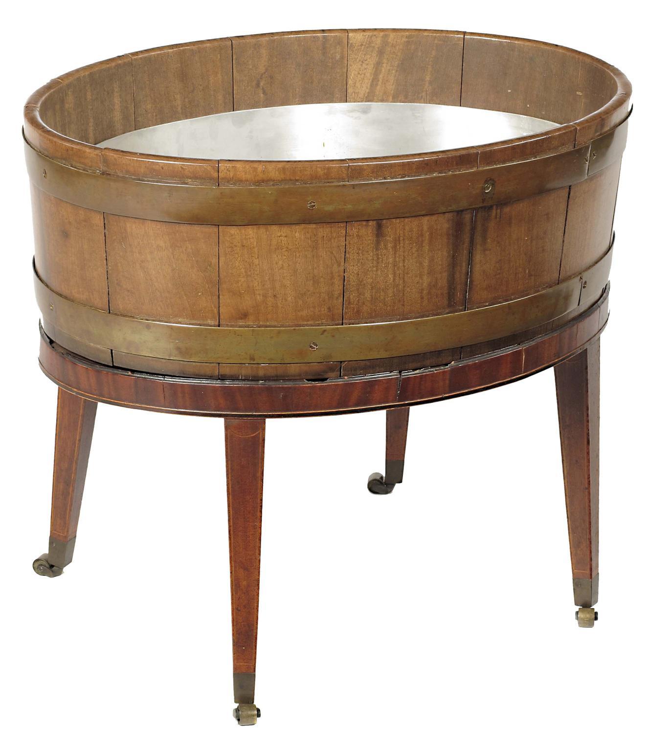 Appraisal: A mahogany and brass bound oval wine cooler on stand