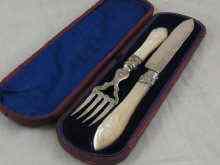 Appraisal: A silver cake knife approx cm long and fork with