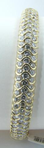 Appraisal: K yellow gold diamond bangle bracelet containing brilliant cut VS